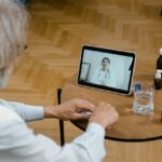 Senior man having a telehealth visit on a electronic tablet
