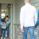 Senior residents welcoming granddaughter and children for a visit